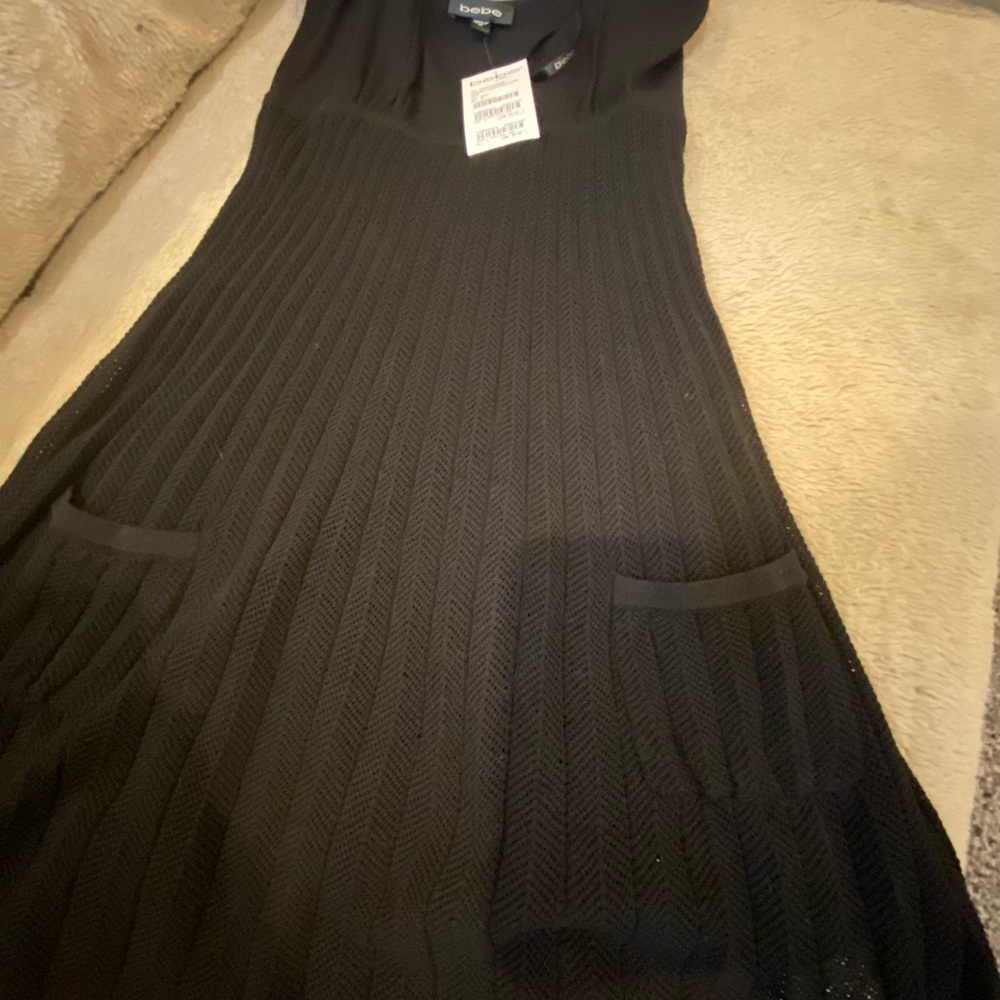 New w/ Tags. Bebe black knit babydoll dress